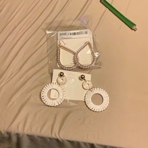 Never worn still in packing. Large 2 in drop  water /gold pierced earrings